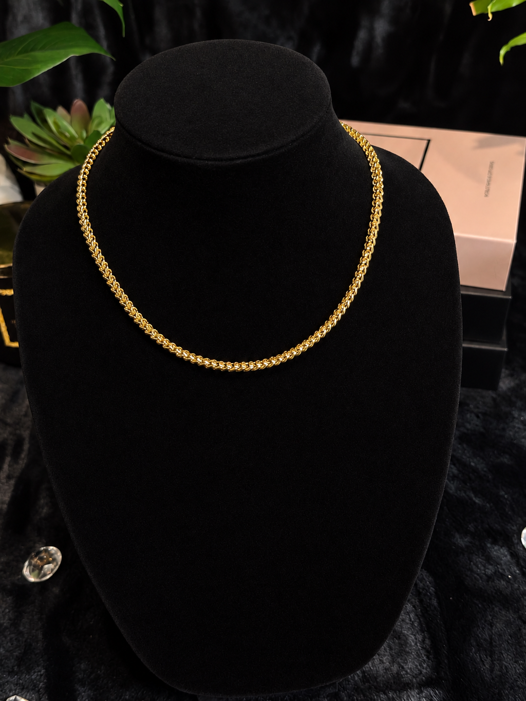 Gold-toned Franco chain necklace displayed on a black velvet bust